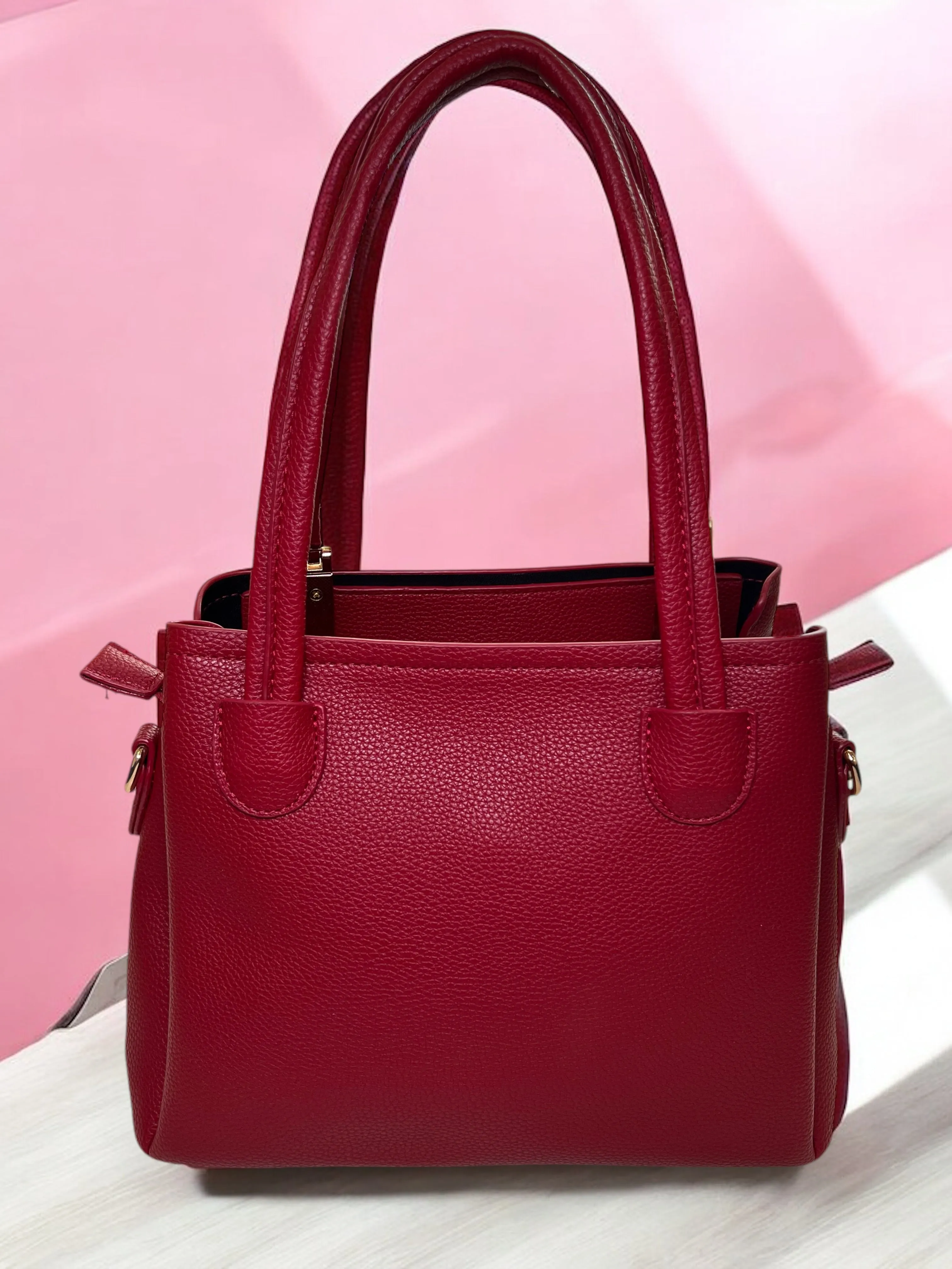Bold Red Structured Handbag with Elegant Gold Accents