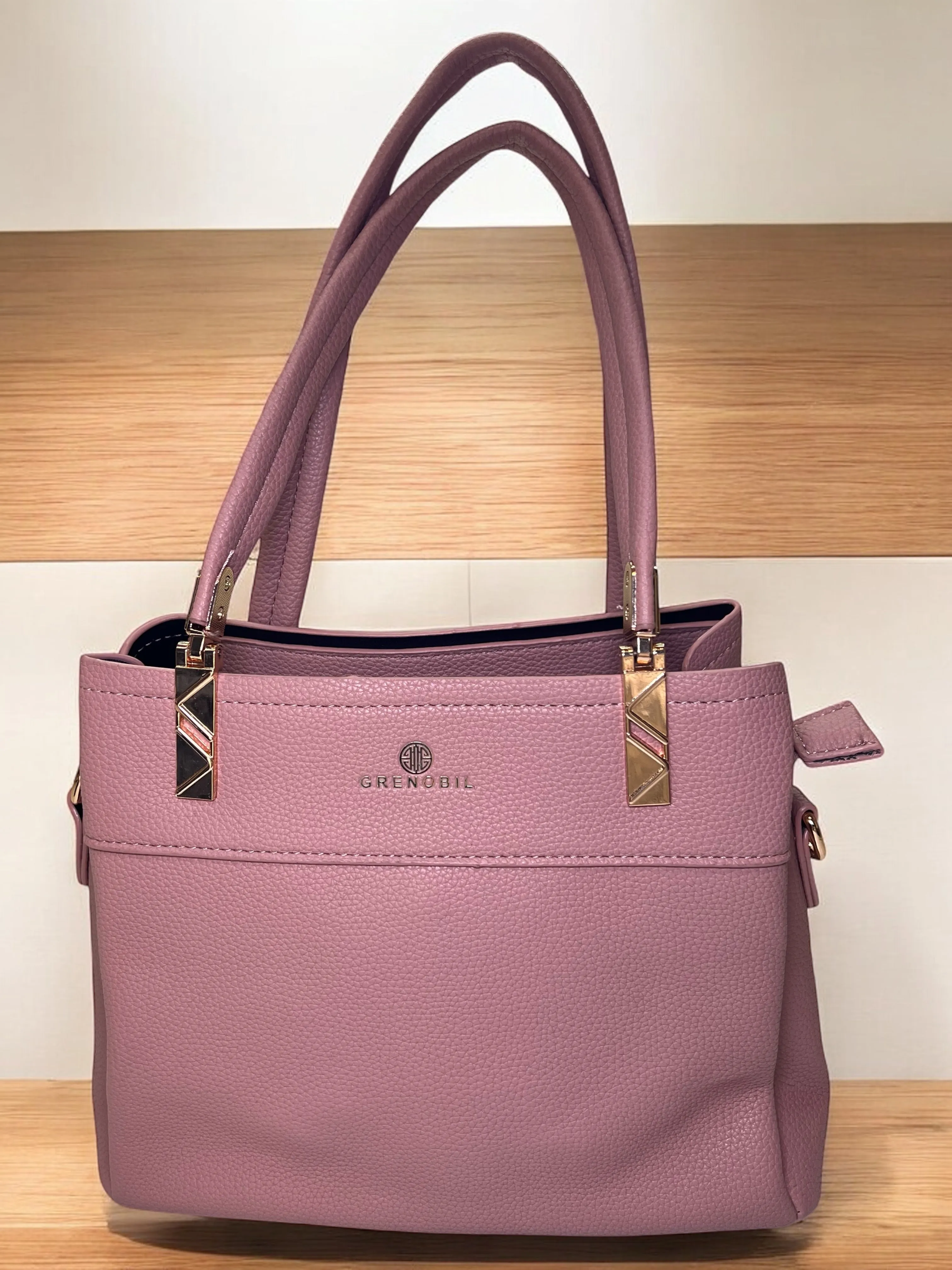 Bold Red Structured Handbag with Elegant Gold Accents